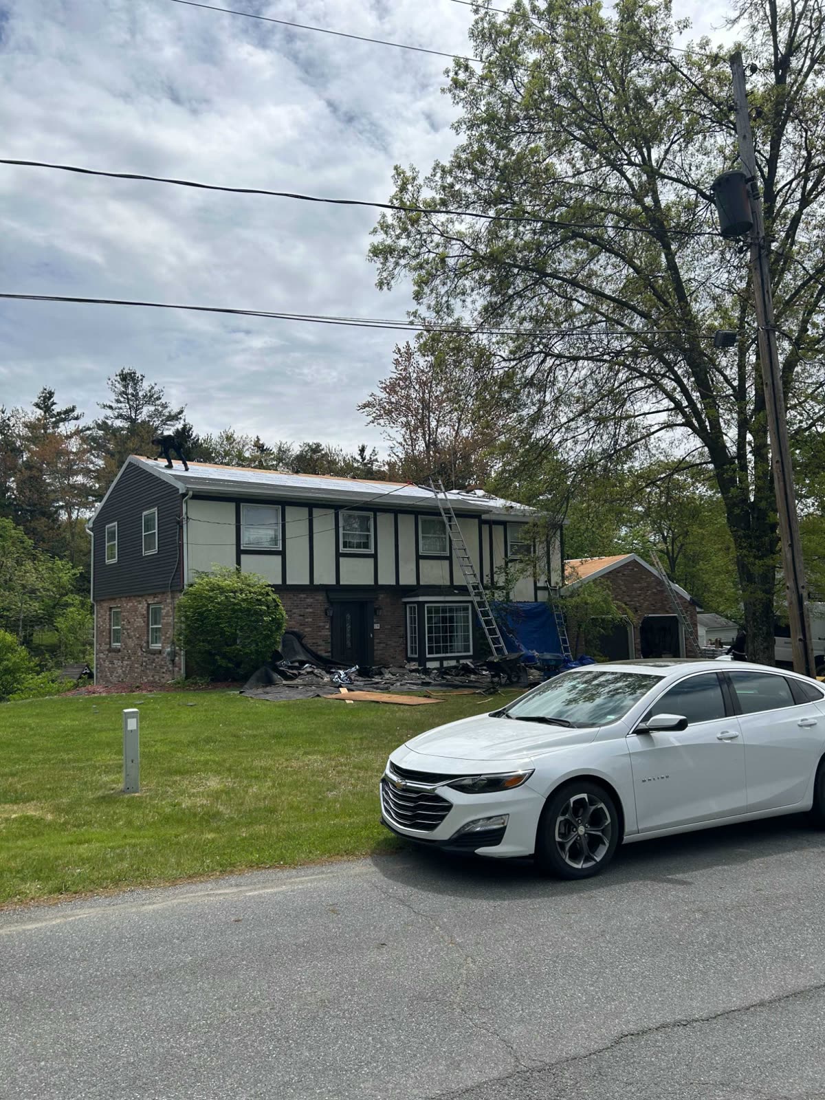 Residential home in Albany with a newly replaced roof, viewed from the street
