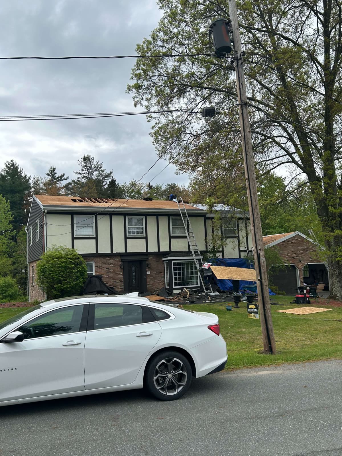 Tudor style home in Albany with steep roof lines and a newly replaced roof